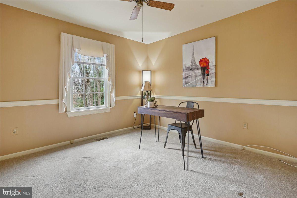 15510 Ridgecrest Drive Dumfries, VA 22025 - Photo 34 of 48 a workspace with furniture and window