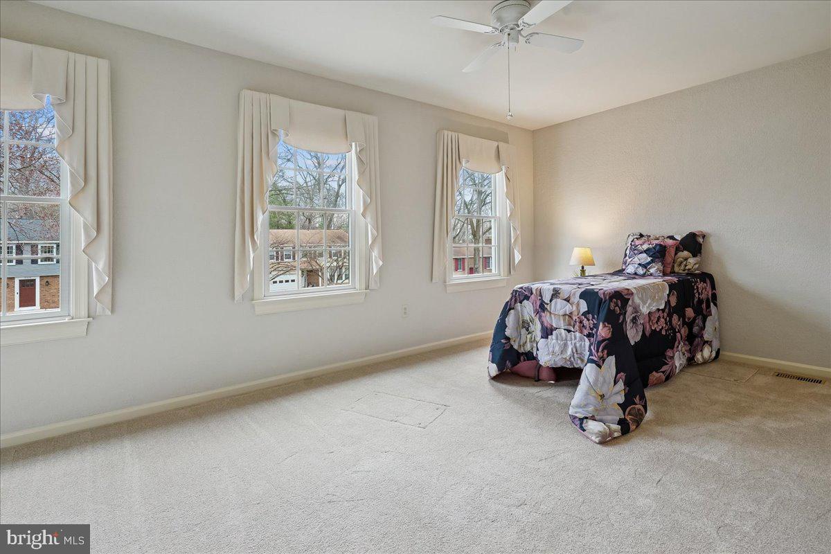 15510 Ridgecrest Drive Dumfries, VA 22025 - Photo 35 of 48 a bedroom with bed and a window