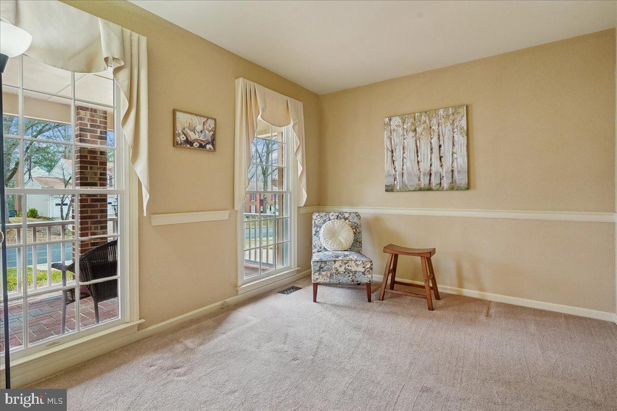 15510 Ridgecrest Drive Dumfries, VA 22025 - Photo 8 of 48 a living room with furniture and a window