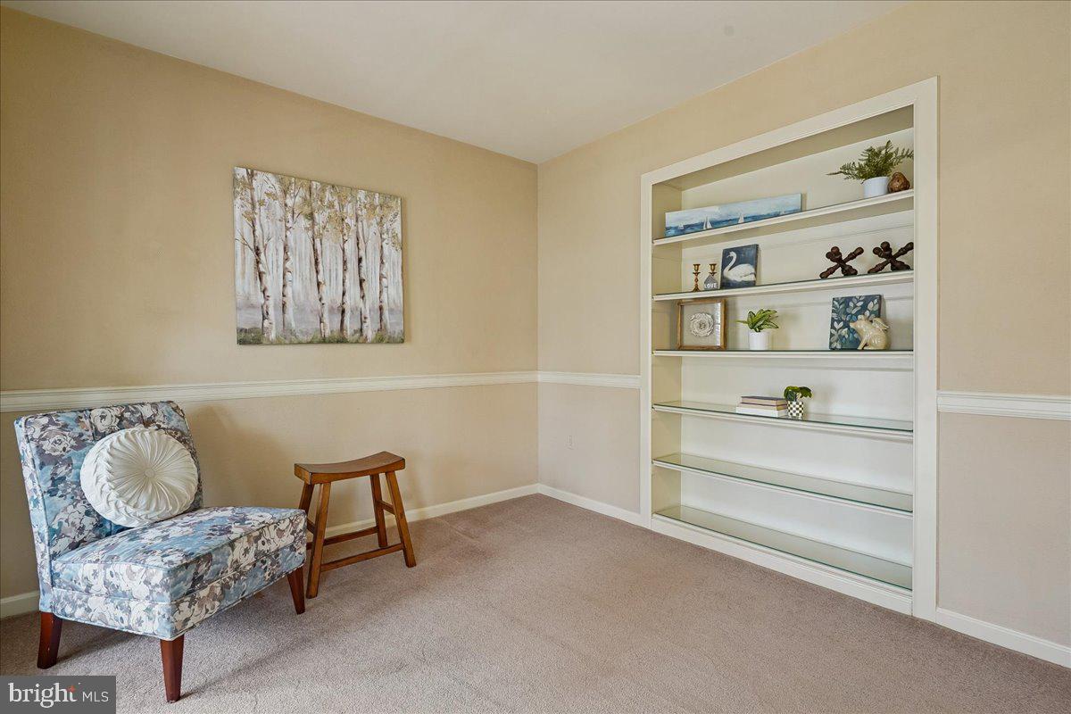 15510 Ridgecrest Drive Dumfries, VA 22025 - Photo 9 of 48 a bedroom with a bed and a painting on the wall