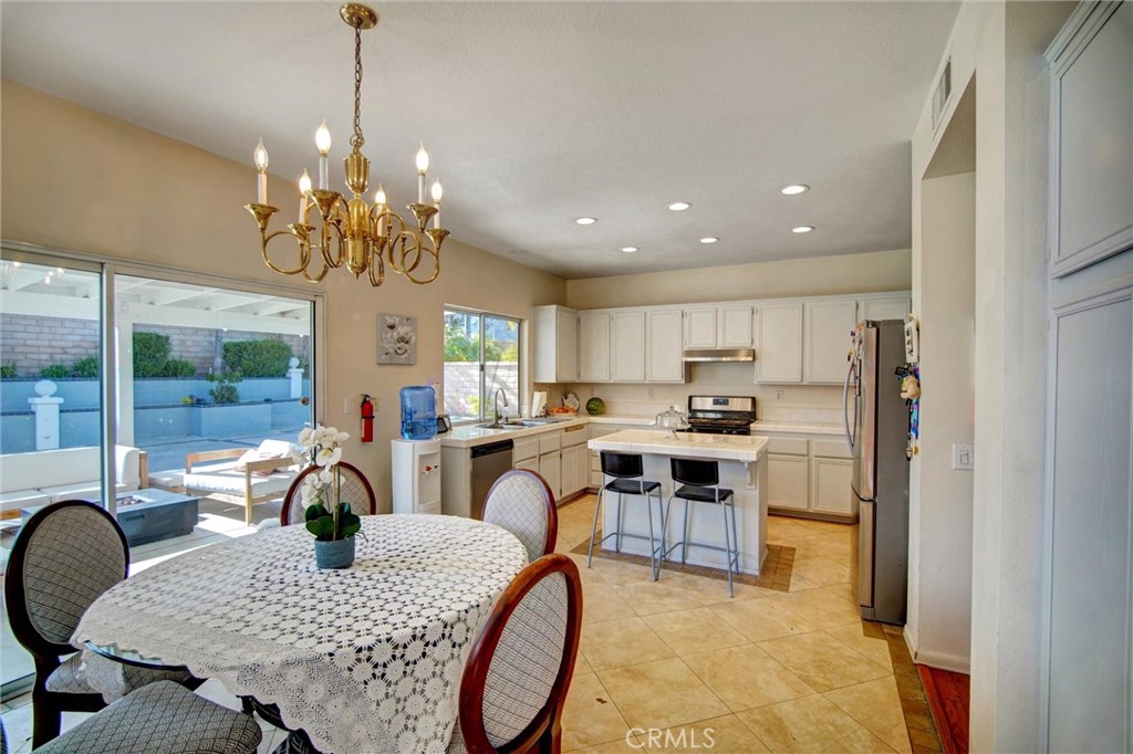 1072 Silvercreek Road Corona, CA 92882 - Photo 11 of 31 a view of a dining room with furniture window and outside view