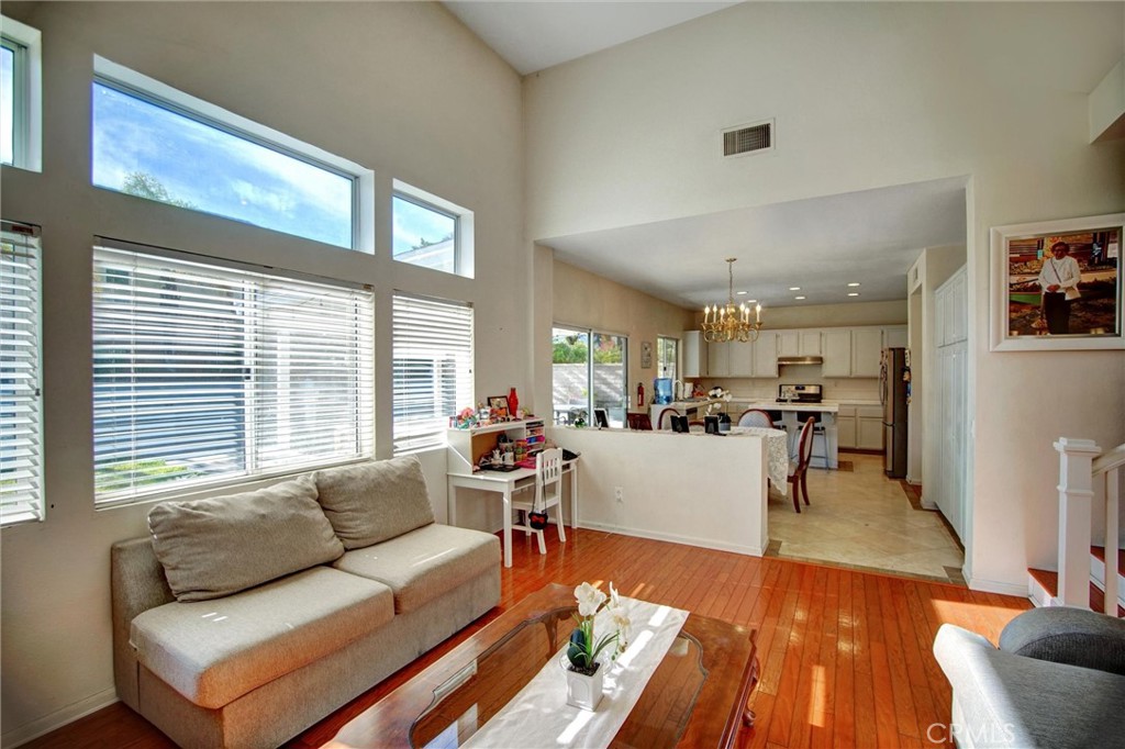 1072 Silvercreek Road Corona, CA 92882 - Photo 14 of 31 a living room with furniture and a large window