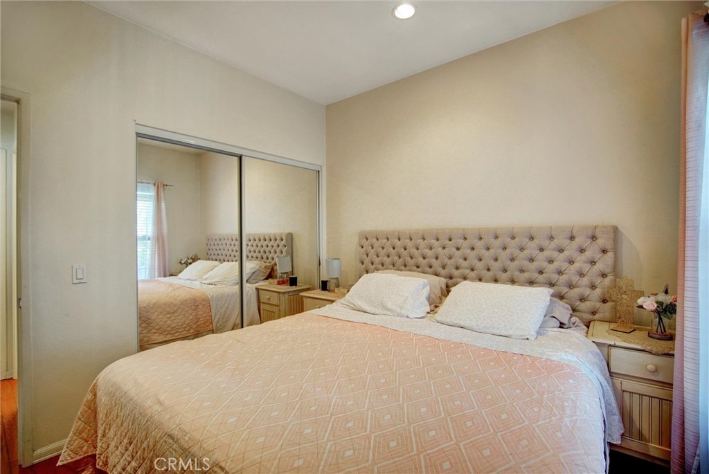1072 Silvercreek Road Corona, CA 92882 - Photo 19 of 31 a bedroom with a bed and a mirror