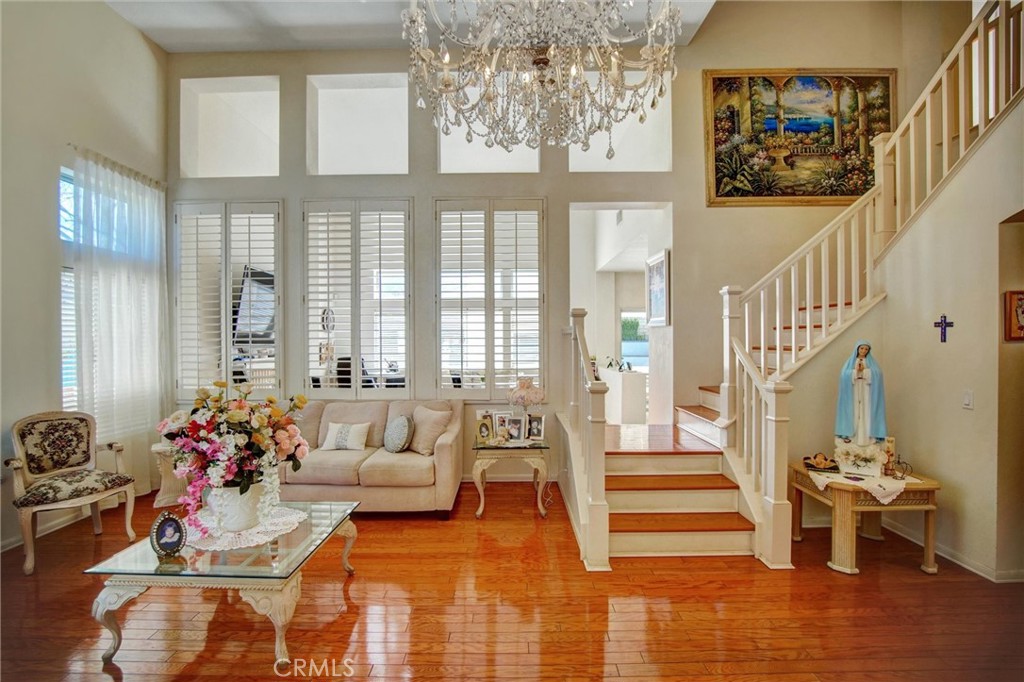 1072 Silvercreek Road Corona, CA 92882 - Photo 2 of 31 a living room with furniture and stairs
