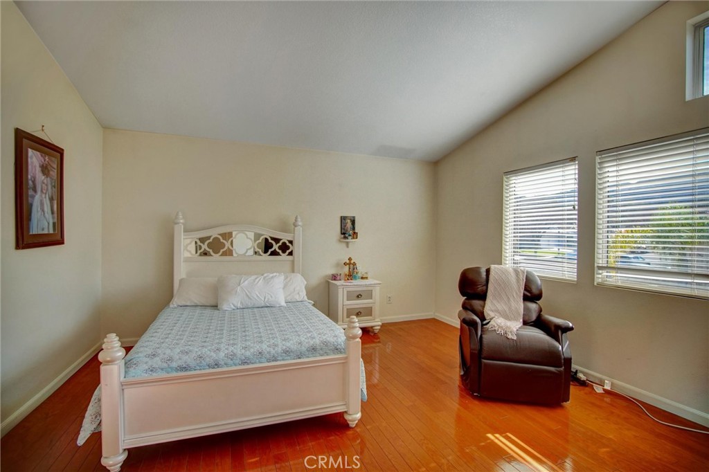 1072 Silvercreek Road Corona, CA 92882 - Photo 23 of 31 a bedroom with a bed and a couch