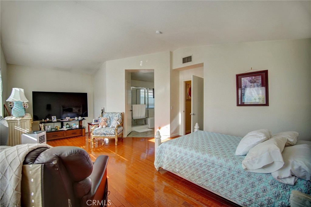 1072 Silvercreek Road Corona, CA 92882 - Photo 24 of 31 a living room with furniture and a flat screen tv