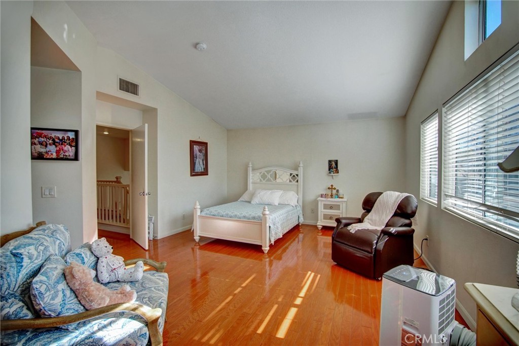 1072 Silvercreek Road Corona, CA 92882 - Photo 25 of 31 a living room with furniture rug and a window