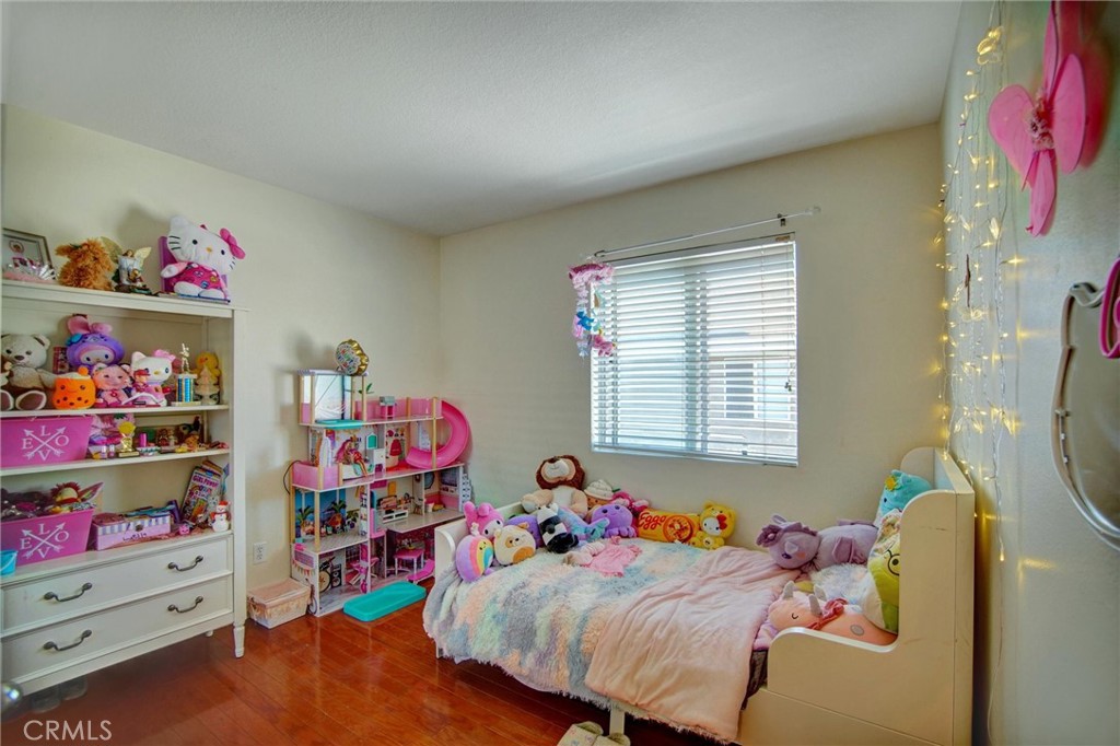 1072 Silvercreek Road Corona, CA 92882 - Photo 27 of 31 a bed room with a bed and a window