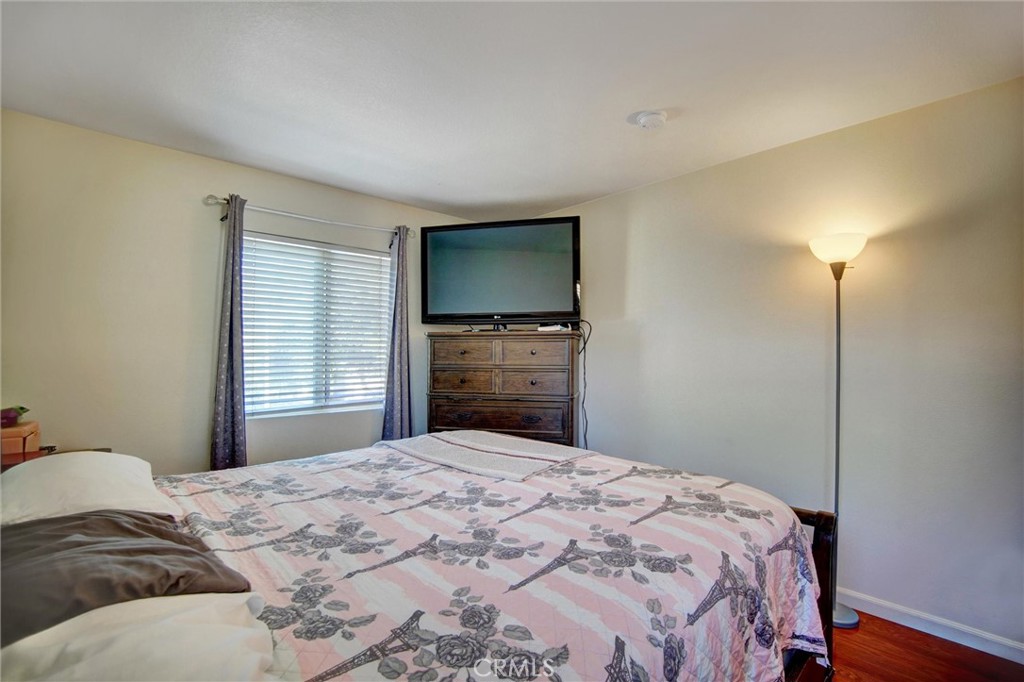 1072 Silvercreek Road Corona, CA 92882 - Photo 31 of 31 a bedroom with a bed and a flat screen tv