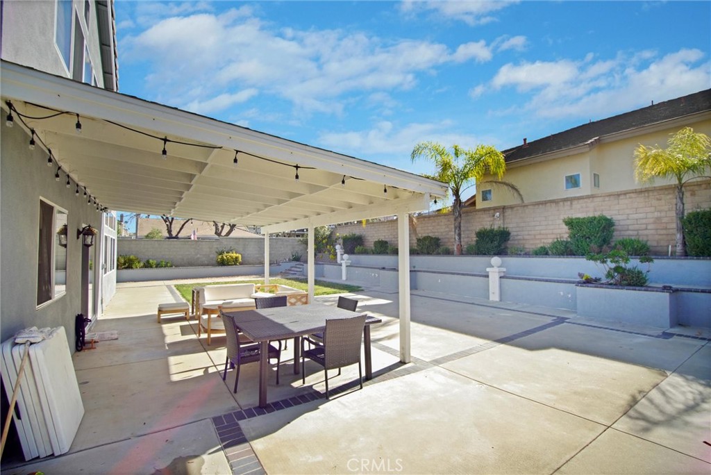 1072 Silvercreek Road Corona, CA 92882 - Photo 6 of 31 a outdoor space with lots of tables a garden and chairs