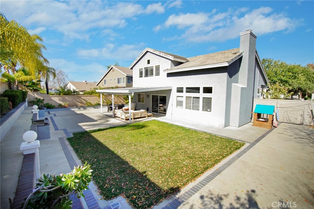 1072 Silvercreek Road Corona, CA 92882 - Photo 7 of 31 a view of a house with pool and chairs