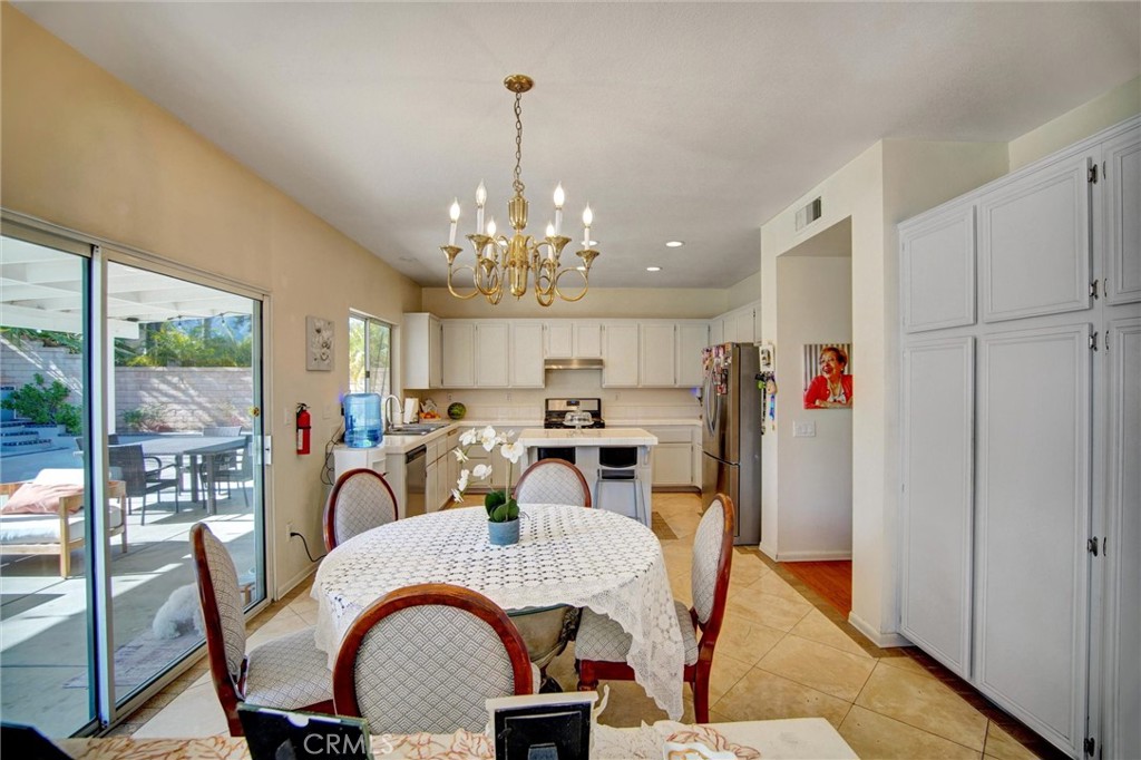 1072 Silvercreek Road Corona, CA 92882 - Photo 10 of 31 a view of a dining room with furniture window and outside view