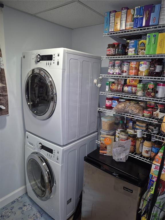 7614 Radcliffe Circle, Unit 104B Port Richey, FL 34668 - Photo 3 of 17 a utility room with dryer and washer