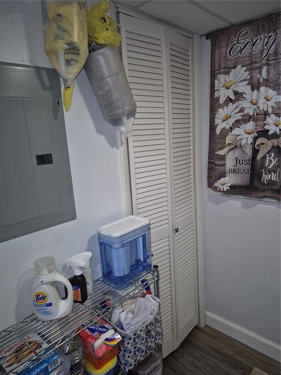 7614 Radcliffe Circle, Unit 104B Port Richey, FL 34668 - Photo 4 of 17 a bedroom with a bed and wooden floor