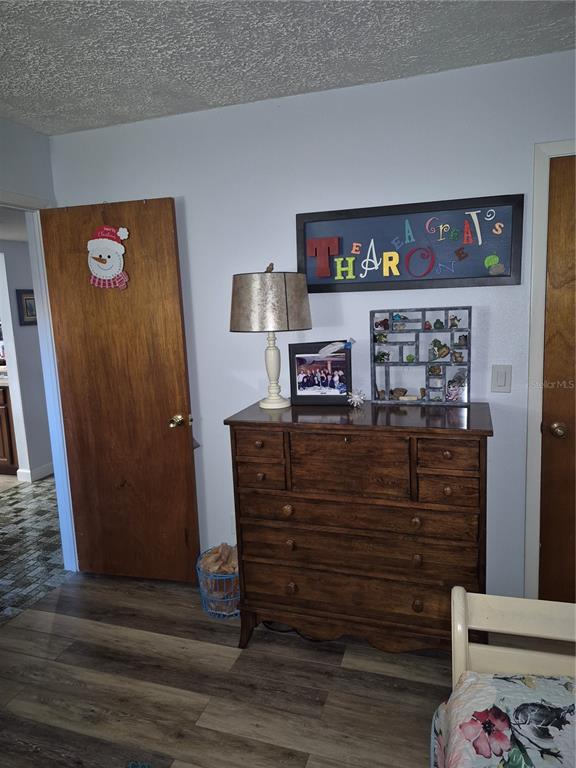 7614 Radcliffe Circle, Unit 104B Port Richey, FL 34668 - Photo 7 of 17 a view of dresser with window