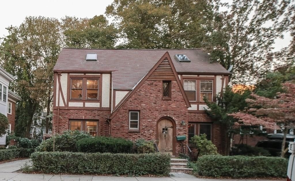 front view of a house with a small yard