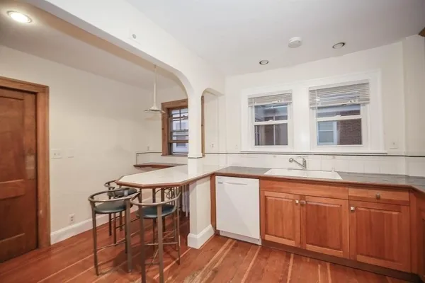 a kitchen with a sink and cabinets