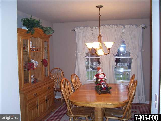 544 Rocky Ridge Road Spring Grove, PA 17362 - Photo 3 of 15 a dining room with furniture a chandelier and window