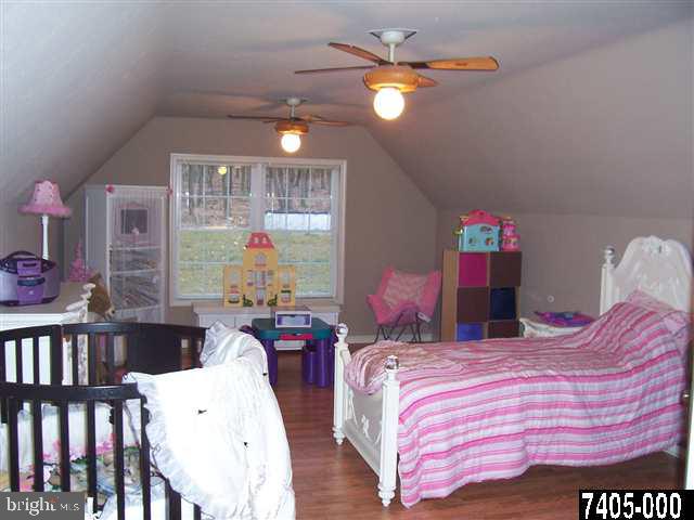 544 Rocky Ridge Road Spring Grove, PA 17362 - Photo 7 of 15 a bed room with a bed and a chandelier