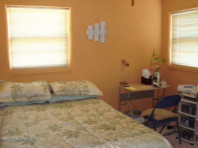 1670 Cortez Road Jacksonville, FL 32246 - Photo 8 of 12 a bedroom with a bed and a window