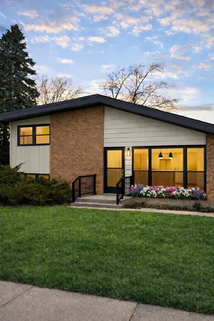 a house view with swimming pool and garden