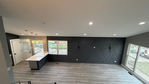 a kitchen with a wooden floor and window