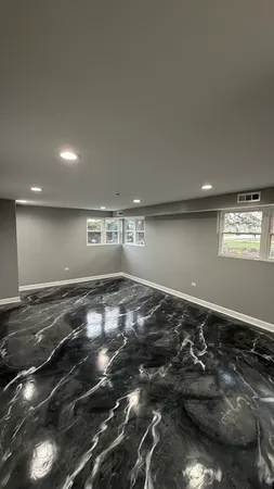 a bathroom with a sink mirror toilet and bathtub