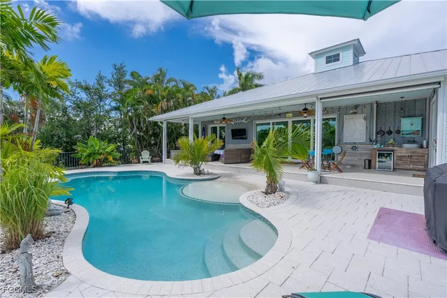a view of a swimming pool with sitting area