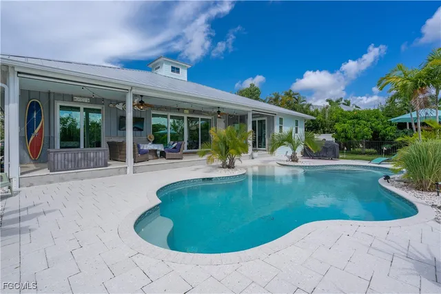 a view of a swimming pool with an outdoor seating