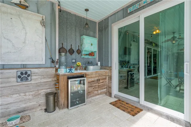 a kitchen with stainless steel appliances kitchen island granite countertop a sink and cabinets