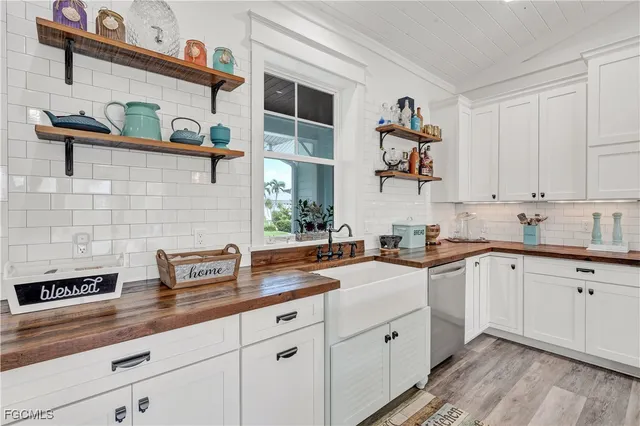 a kitchen with a sink and cabinets