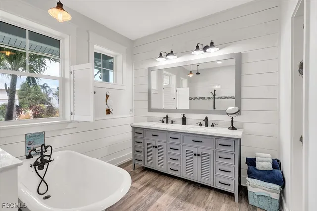 a bathroom with a double vanity sink mirror and double