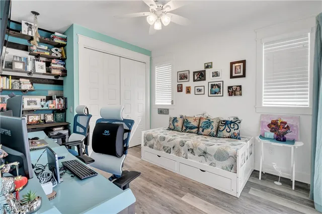 a bedroom with furniture and a book shelf