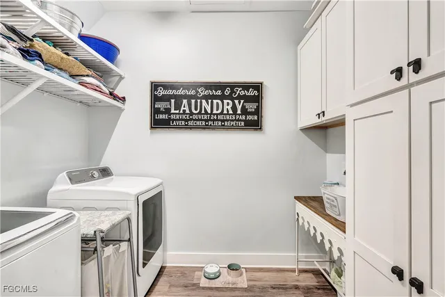 a view of storage and utility room with washer and dryer
