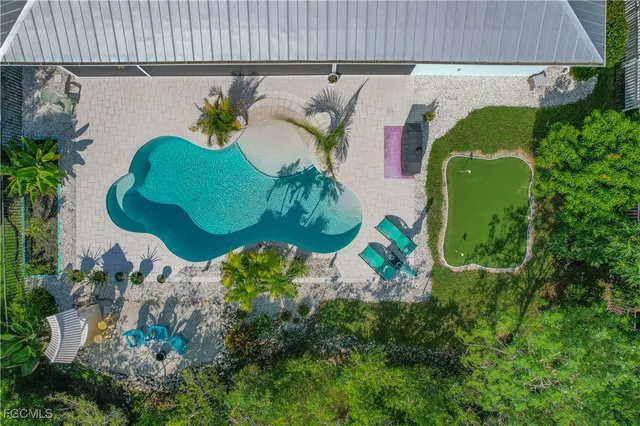 an aerial view of a house with a garden and plants