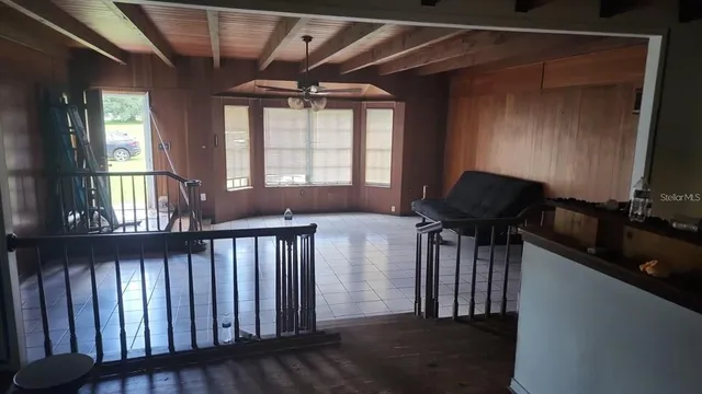 a view of entryway with a window and wooden floor