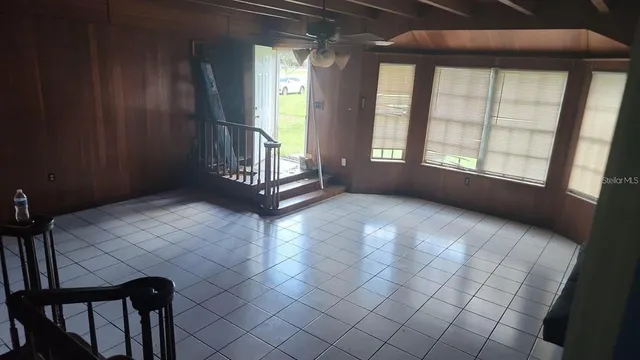 a view of an empty room with a window