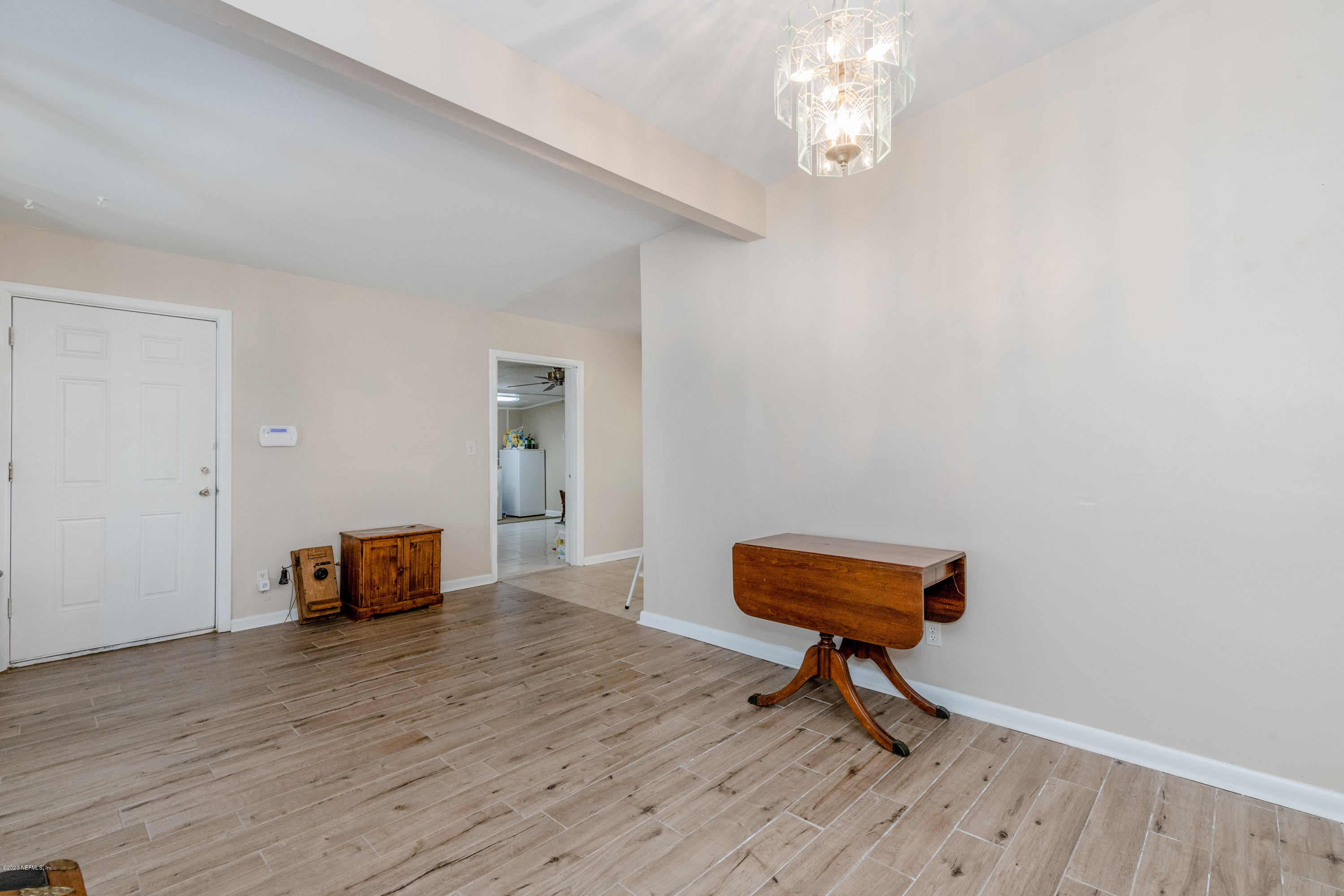 6921 Arques Road Jacksonville, FL 32205 - Photo 8 of 25 a living room with furniture and a wooden floor