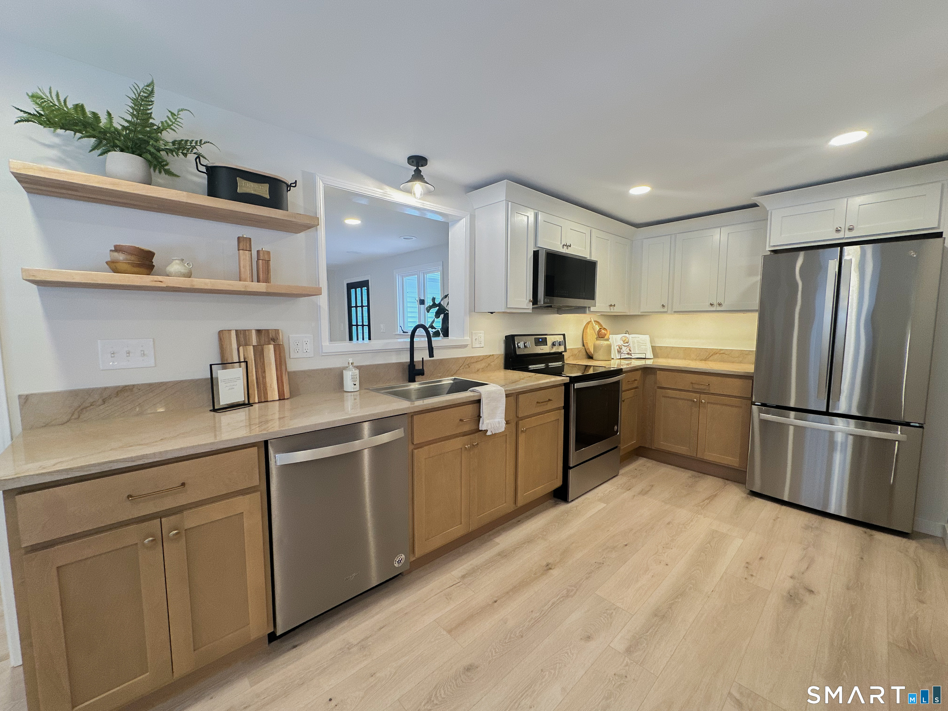 92 Rose Haven Road Somers, CT 06071 - Photo 4 of 17 a kitchen with a sink refrigerator and microwave