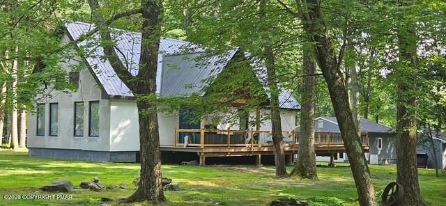 128 Gabrielle Lane Dingmans Ferry, PA 18328 - Photo 1 of 56 a view of a house with a swimming pool