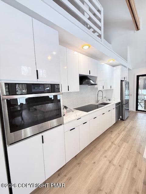 128 Gabrielle Lane Dingmans Ferry, PA 18328 - Photo 13 of 56 a kitchen with stainless steel appliances kitchen island granite countertop a sink a stove and cabinets