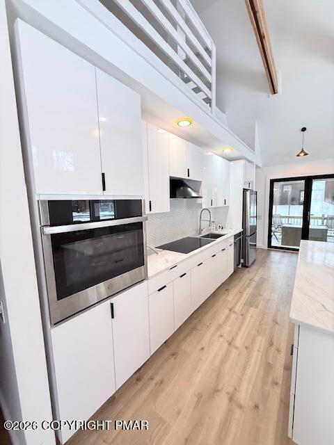128 Gabrielle Lane Dingmans Ferry, PA 18328 - Photo 16 of 56 a large kitchen with a stove and a sink