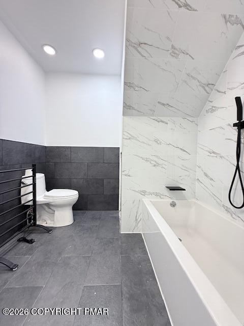 128 Gabrielle Lane Dingmans Ferry, PA 18328 - Photo 30 of 56 a bathroom with a bathtub and toilet