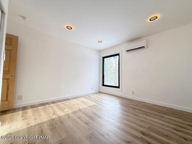 128 Gabrielle Lane Dingmans Ferry, PA 18328 - Photo 44 of 56 an empty room with wooden floor and windows