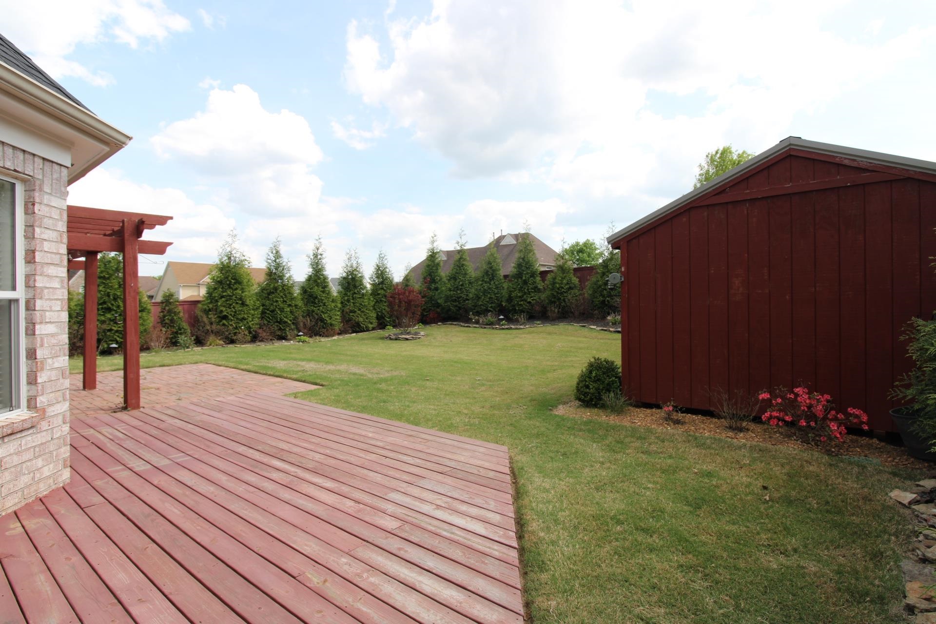 25 Whispering Ridge Cove Oakland, TN 38060 - Photo 17 of 19 Wooden terrace with a storage unit
