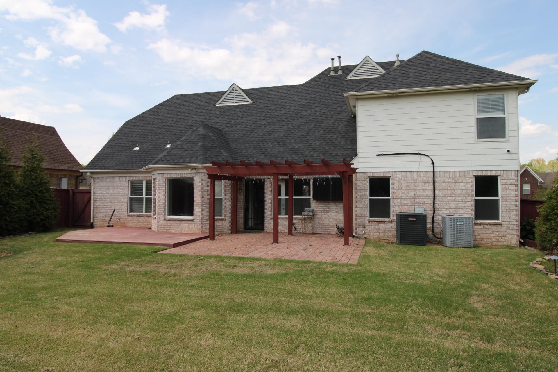 25 Whispering Ridge Cove Oakland, TN 38060 - Photo 19 of 19 Rear view of property with a patio area, a pergola, brick siding, and a shingled roof