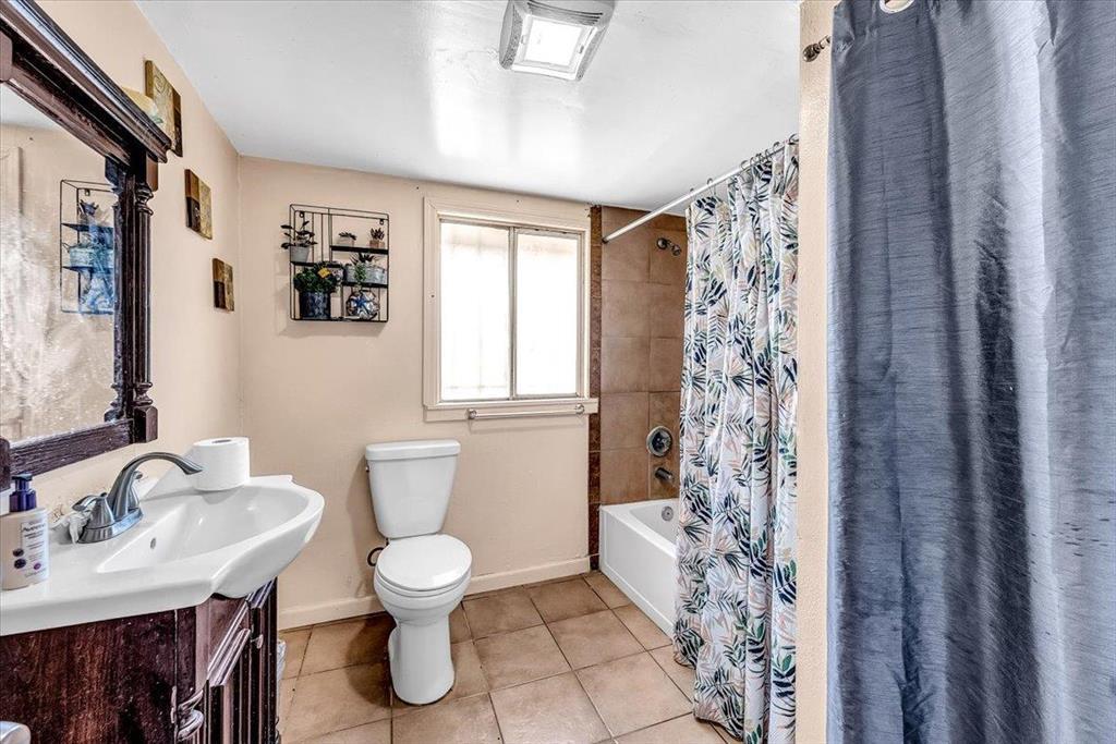 112 Serrano Place Soledad, CA 93960 - Photo 15 of 19 a bathroom with a granite countertop sink toilet a mirror and shower