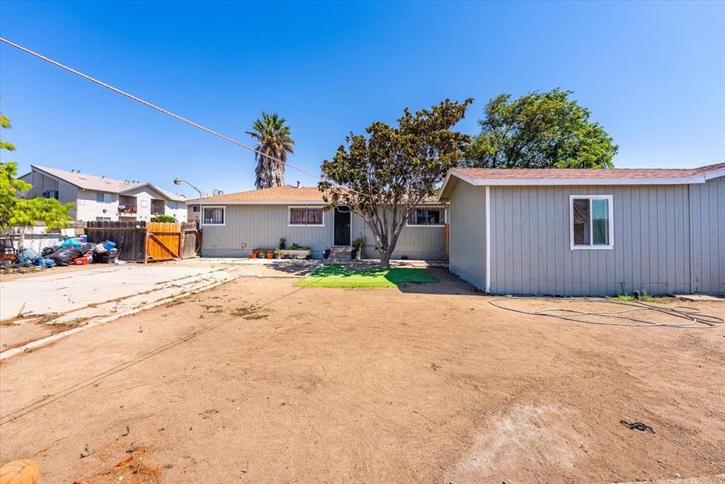 112 Serrano Place Soledad, CA 93960 - Photo 2 of 19 a front view of a house with a yard and garage