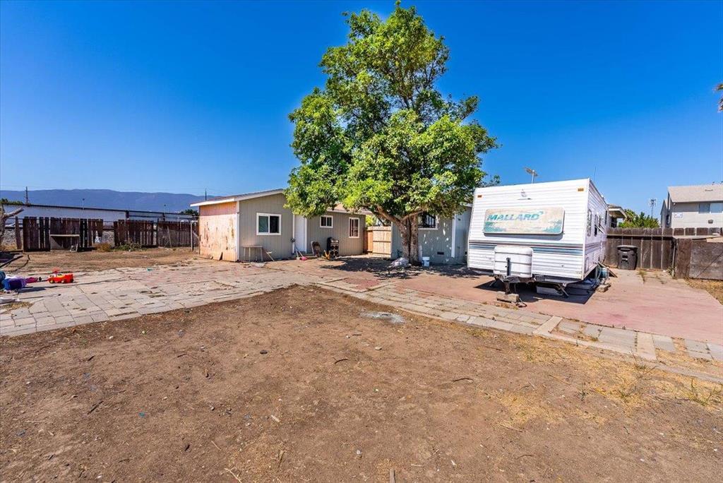 112 Serrano Place Soledad, CA 93960 - Photo 3 of 19 a white house that has a tree in front of it