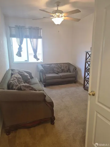 a bedroom with a bed and a mirror